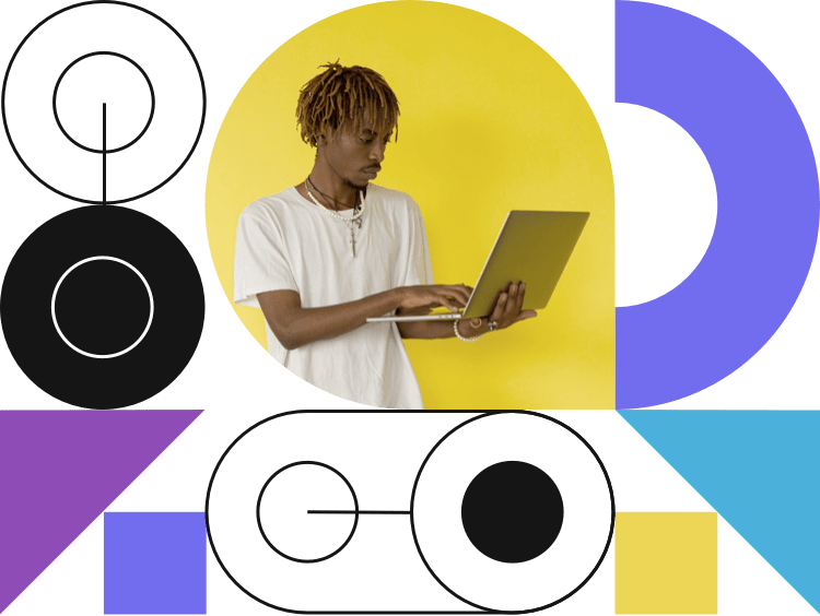 geometric shapes and man on laptop