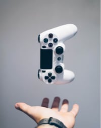 gaming controller floating over hand